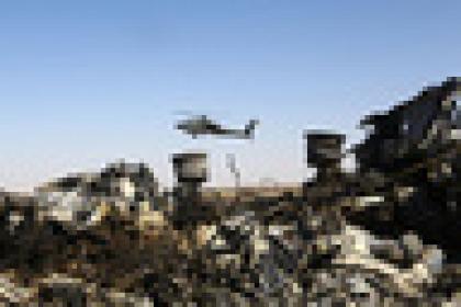 (151101) -- ARISH CITY, Nov. 1, 2015 (Xinhua) -- An Egyptian military helicopter flies over debris of a Russian passenger airplane which crashed at the Hassana area in Arish city, north Egypt, on November 1, 2015. Egyptian and international investigators on Sunday have begun probing the reasons of the Russian plane that crashed in Egypt's Sinai peninsula on Saturday which killed all 224 on board. (Xinhua/Ahmed Gomaa) (Photo by Xinhua/Sipa USA)