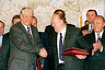 Russian President Boris Yeltsin and Byelorussian leader Stanislav Shushkevich, exchange Slavic Treaty in Brest, USSR (Russian Federation) Dec. 7, 1991.