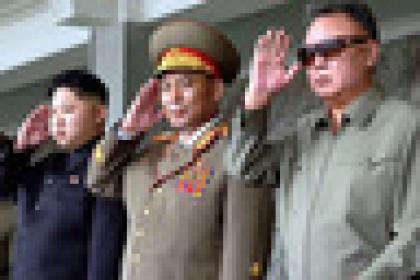 --- EDITORS NOTE -- RESTRICTED TO EDITORIAL USE - MANDATORY CREDIT  " AFP PHOTO / KCNA via KNS "  -  NO MARKETING NO ADVERTISING CAMPAIGNS   -   DISTRIBUTED AS A SERVICE TO CLIENTS   (FILES) This picture released by North Korea's official Korean Central News Agency on September 10, 2011 via the Tokyo-based Korean News Service (KNS) shows North Korean leader Kim Jong-Il (R) and his son Kim Jong-un (2nd L) appearing at a military parade to celebrate the 63rd founding anniversary of the Democratic People's Republic of Korea in Pyongyang on September 9, 2011.  North North Korean leader Kim Jong-Il has died aged 69 of a heart attack, state media announced on December 19, 2011, plunging the impoverished but nuclear-armed nation into uncertainty amid a second dynastic succession.       
